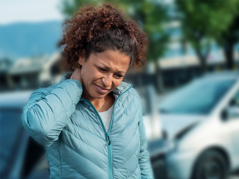 Patient getting neck adjusted for whiplash pain