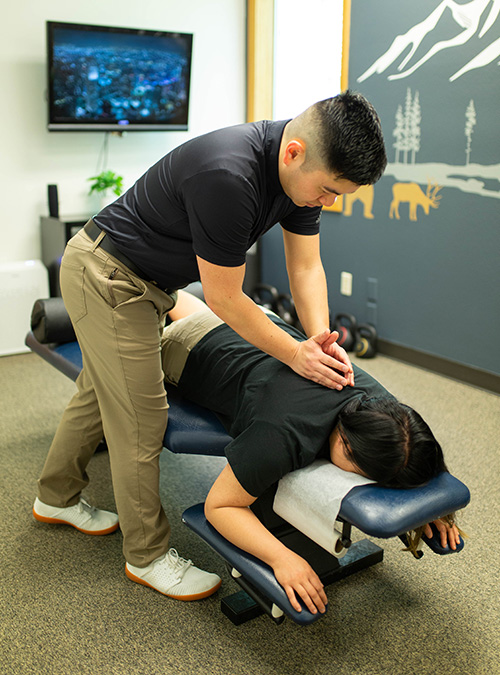 Dr. Tran Adjusting a Patient